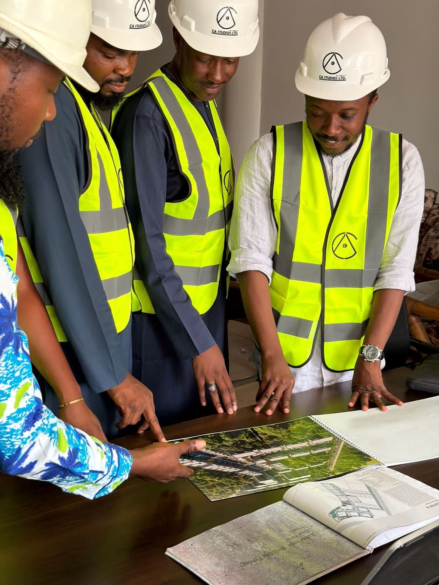 Engineers reviewing a building site plan